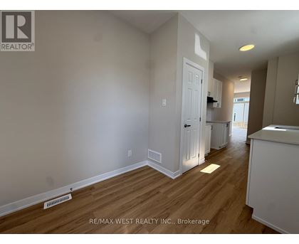 A room with a white door and a white cabinet.
