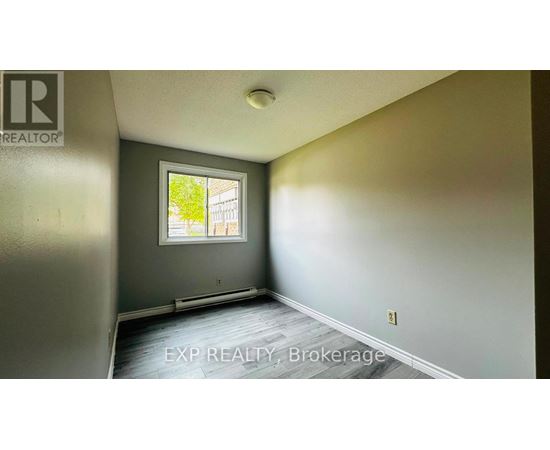 A room with EXP REALTY, Brokerage watermark on the floor.