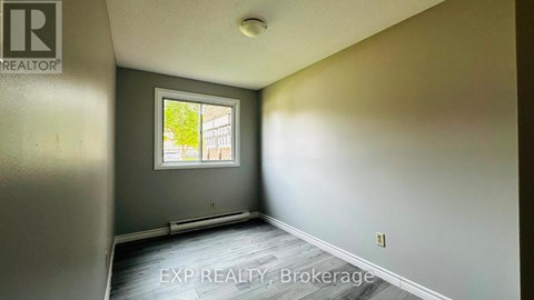 A room with EXP REALTY, Brokerage watermark on the floor.