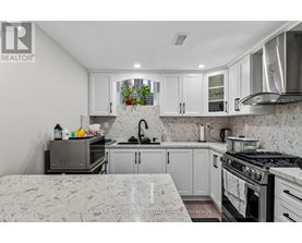 A kitchen with a stove top oven and a microwave.