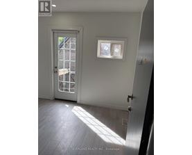 A room with a door and a window.