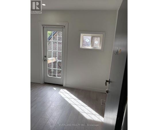 A room with a door and a window.