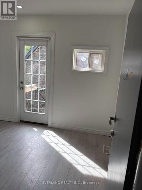 A room with a door and a window.