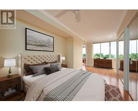 A bedroom with a large bed and a painting on the wall.