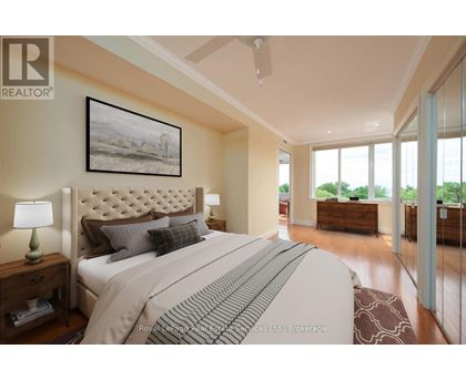 A bedroom with a large bed and a painting on the wall.