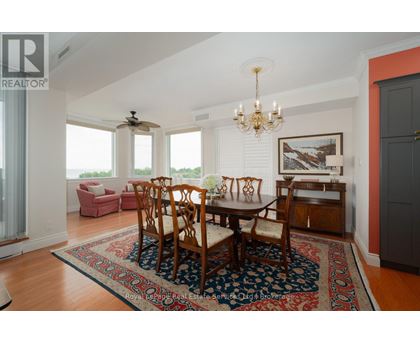 A dining room with a table set for six.