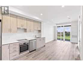 A modern kitchen with wooden cabinets and stainless steel appliances.