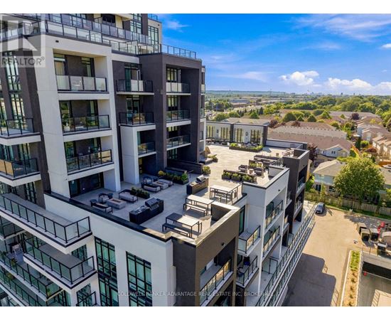 A modern apartment complex with multiple balconies and parking spaces.