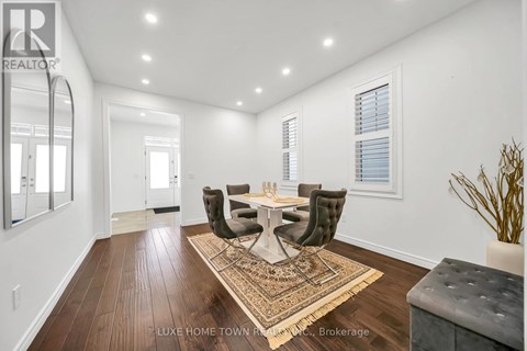 A dining room with a table set for four.