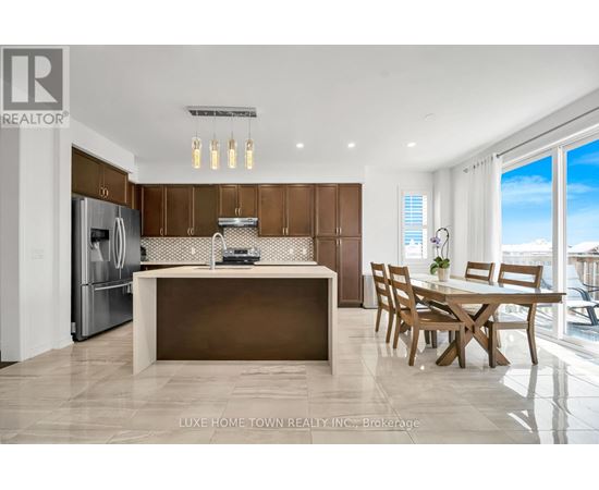 A modern kitchen with wooden cabinets and a large island.