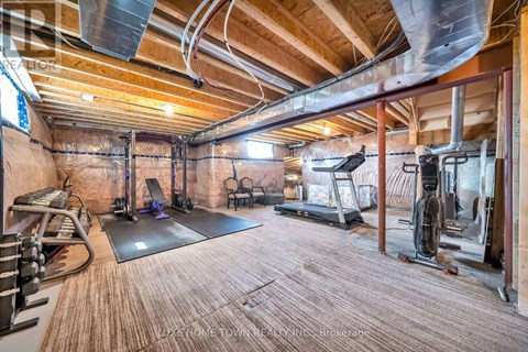 A spacious home gym with a variety of exercise equipment.