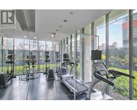 A gym with treadmills and exercise bikes.