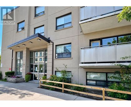 A building with a balcony and a sign that says REALTOR.