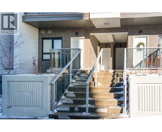 A house with a staircase leading to the front door.