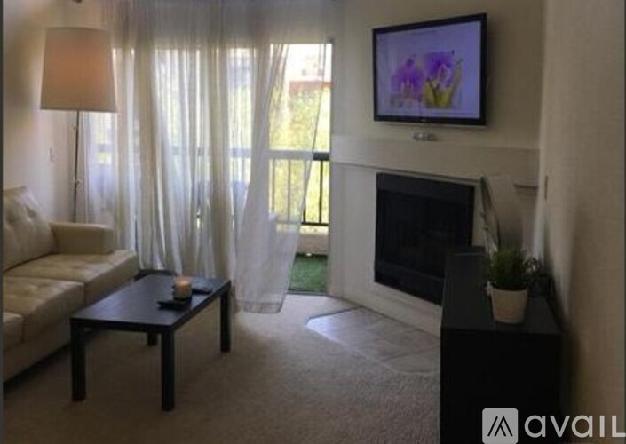 A living room with a fireplace and a couch.