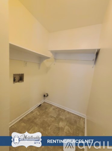 A room with a beige carpet and a white ceiling.