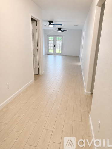 A room with a tiled floor and a ceiling fan.