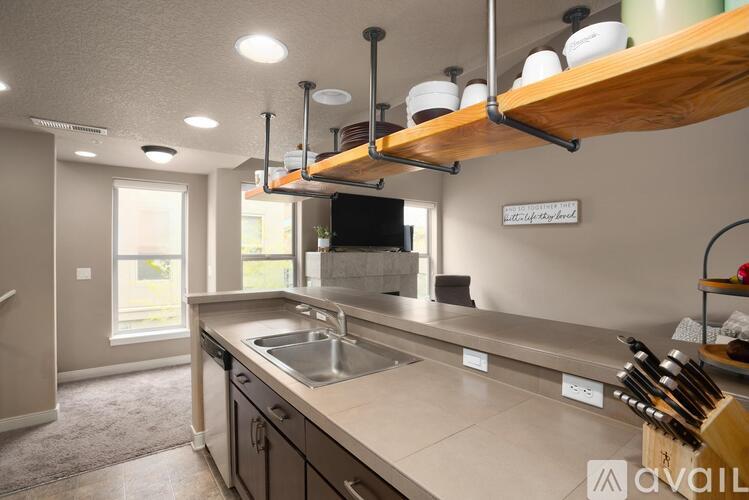 A kitchen with a sink and a window.