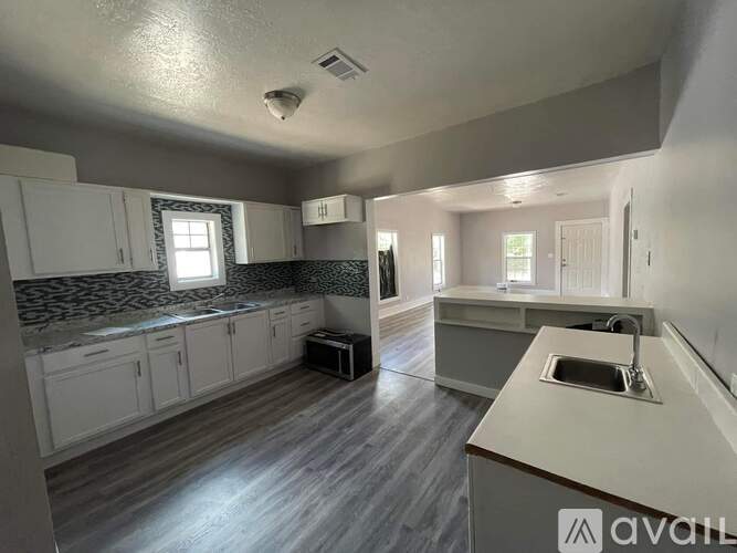 A kitchen with a countertop and cabinets.