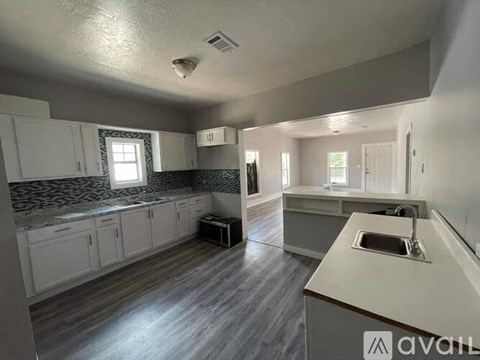 A kitchen with a countertop and cabinets.