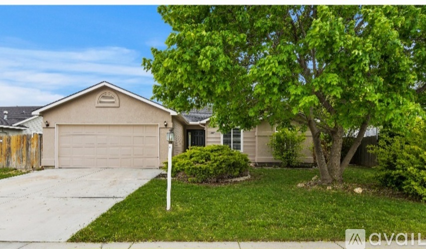 A house with a tree in front of it.
