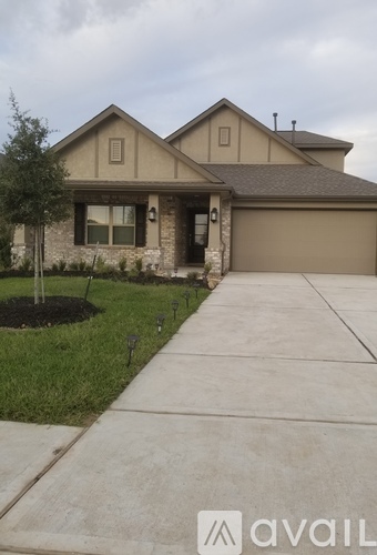 A house with a driveway in front of it.