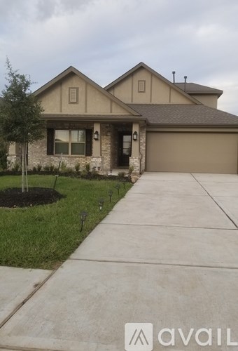 A house with a driveway in front of it.
