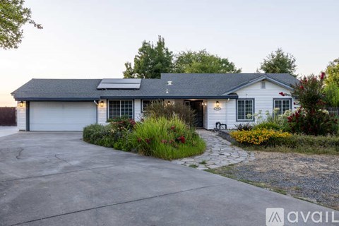 A house with a driveway and a garage door.