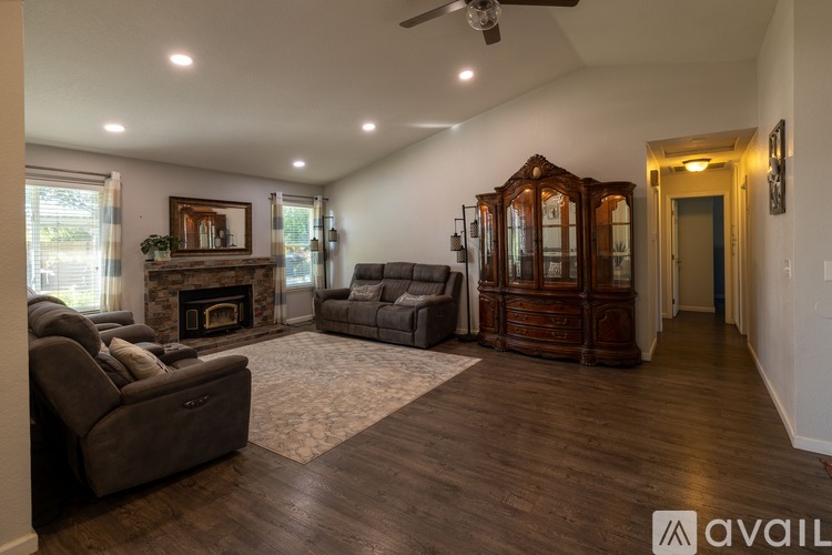 A living room with a fireplace and a couch.