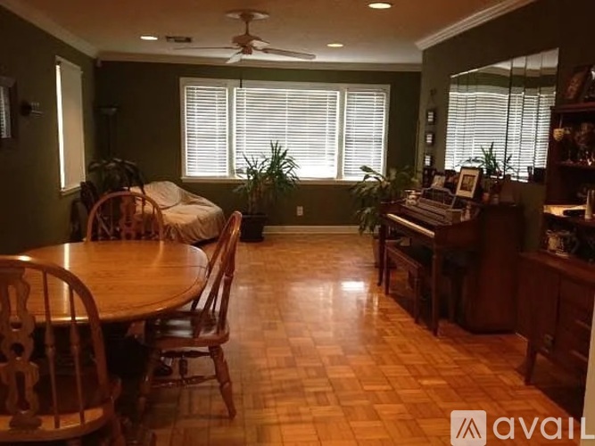 A room with a table and chairs in it.