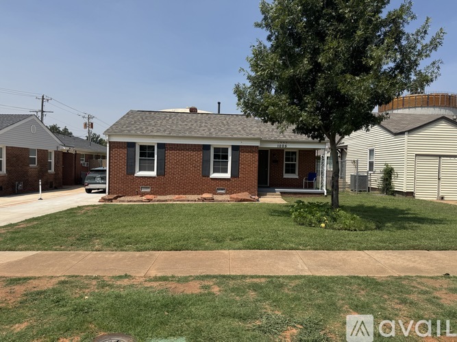 A house with a tree in front of it.