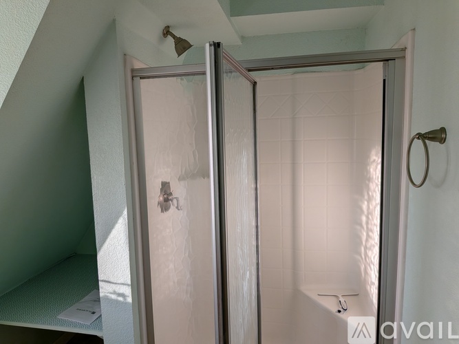 A white door with a glass panel is open.