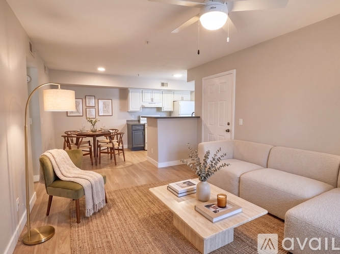 A living room with a couch, chair, and coffee table.