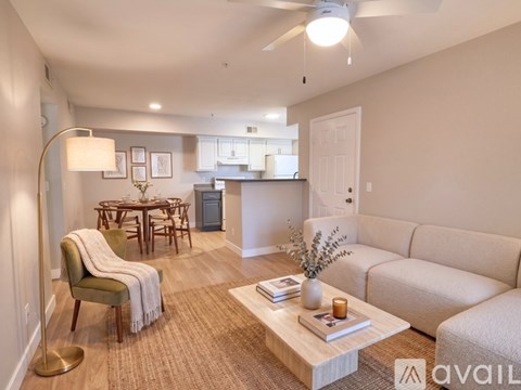 A living room with a couch, chair, and coffee table.