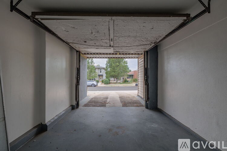 A view from inside a building looking out through a large open door.