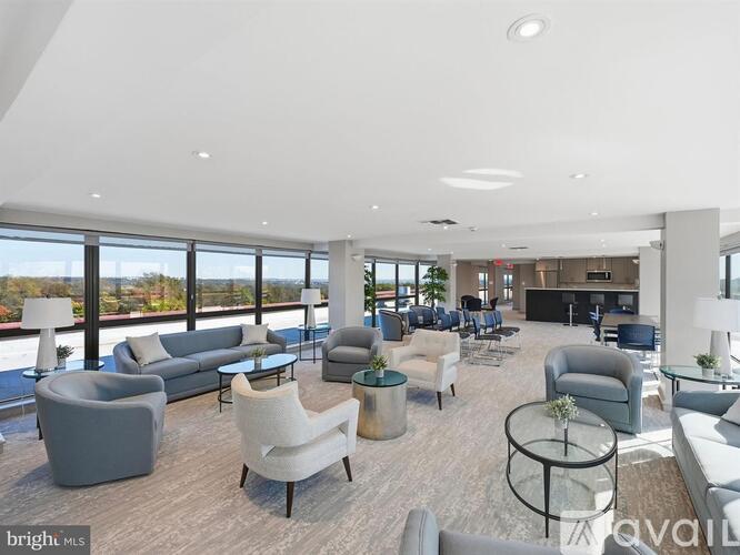 A bright and modern living room with a variety of seating options.