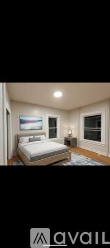 A bedroom with a bed, nightstand, and lamp.