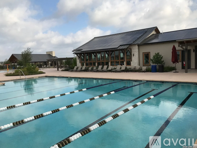 A large outdoor swimming pool with lane markers.