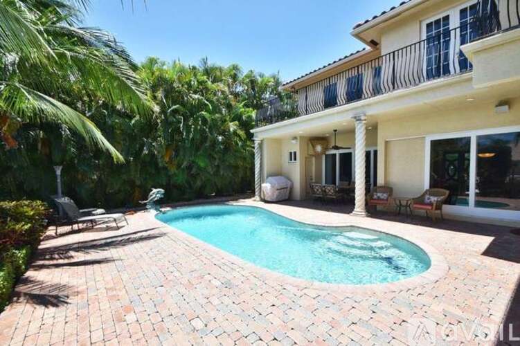 A house with a pool in the backyard.