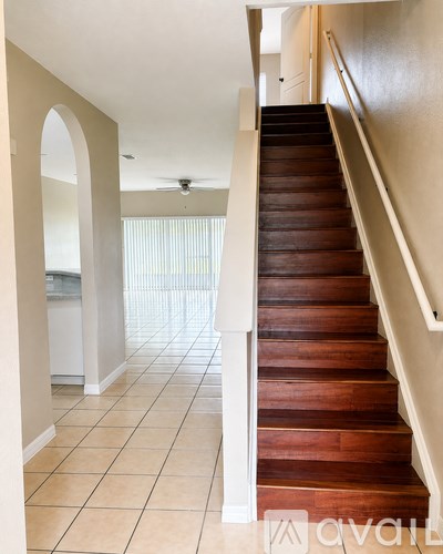 A staircase with a wooden tread and white risers.