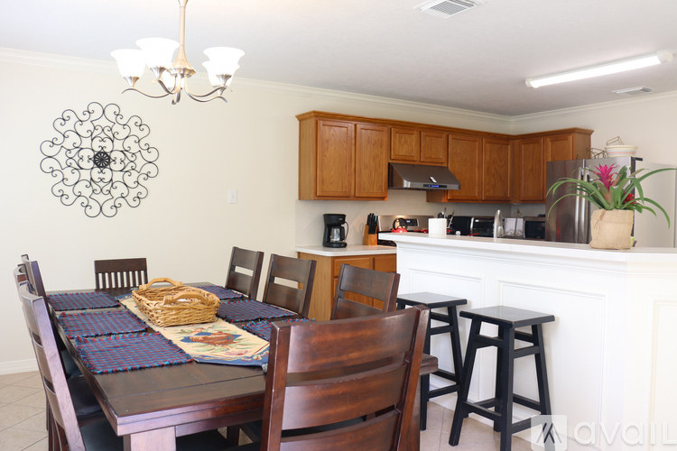 A kitchen with a table set for a meal.