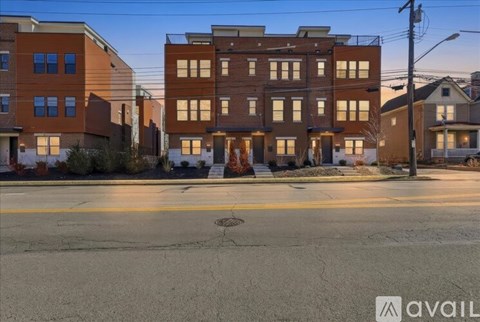 A street view of a residential area with apartment buildings.