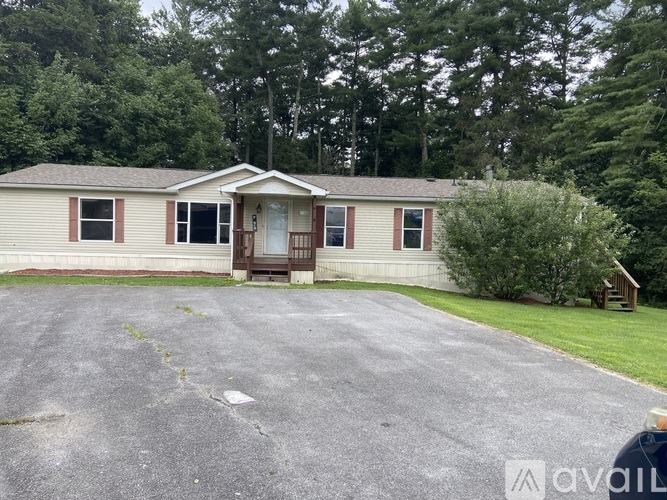 A house with a driveway in front of it.