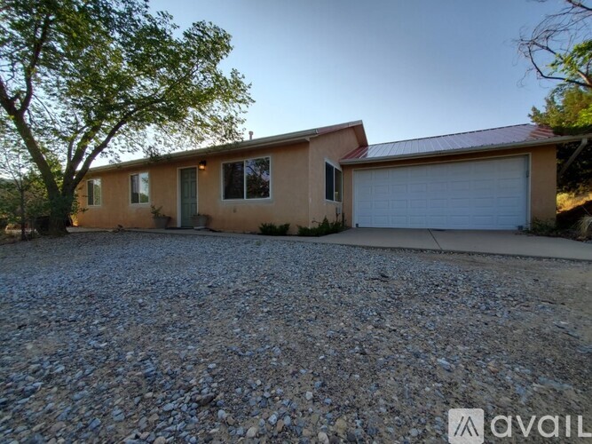 A house with a garage is available for rent.
