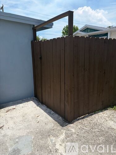 A wooden fence with a metal bracket on top.