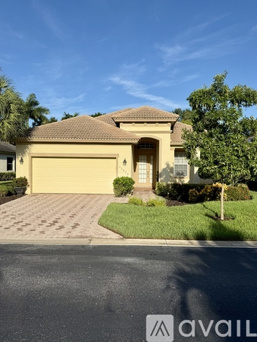 A house with a driveway in front of it.