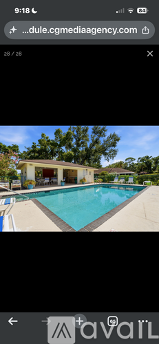 A swimming pool in front of a house.