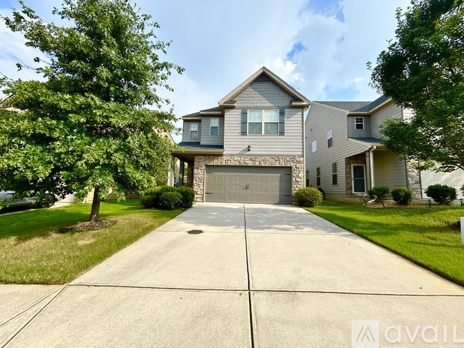 A house with a garage is for sale.