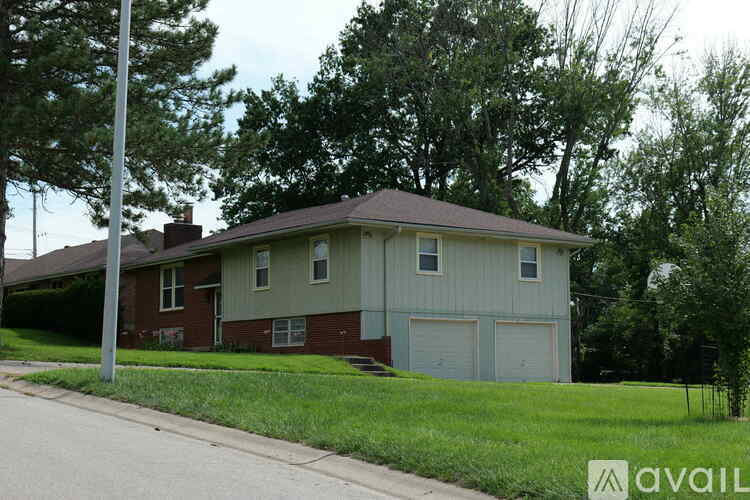 A house with a garage is for sale.
