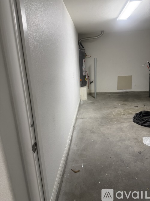 A white door with a silver handle is on the left side of the image.